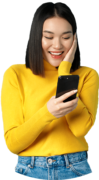 Image of happy asian woman reading message on mobi fkggsj9 e1650561666821